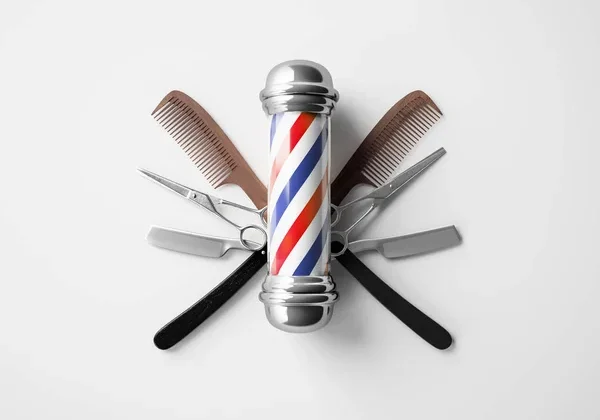 depositphotos_219568142-stock-photo-barbers-pole-tools-white-background